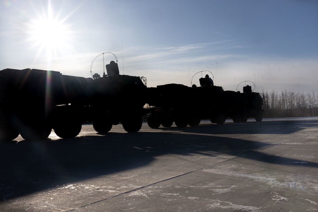 U.S. Marines with Fox Battery, 2nd Battalion, 14th Marine Regiment, 4th Marine Division, Marine Forces Reserve prepare to onload High Mobility Artillery Rocket Systems (HIMARS) onto C-130 J Hercules aircrafts as part of a HIMARS Rapid Infiltration, also known as a HIRAIN, during exercise Arctic Edge 2024, at Eielson Air Force Base, Alaska, Feb. 24, 2024. The HIRAIN training demonstrated Marine Forces Reserve’s ability to rapidly deploy the HIMARS to meet and deter any threats in any environment, including harsh arctic environments. Arctic Edge 2024 (AE24) is a U.S. Northern Command-led homeland defense exercise demonstrating the U.S. military’s capabilities in extreme cold weather, joint force readiness, and U.S. military commitment to mutual strategic security interests in the arctic region. (U.S. Marine Corps photo by Lance Cpl. Madisyn Paschal)