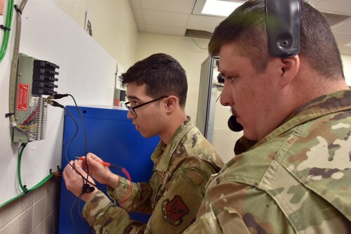 Airmen practice using telecom equipment