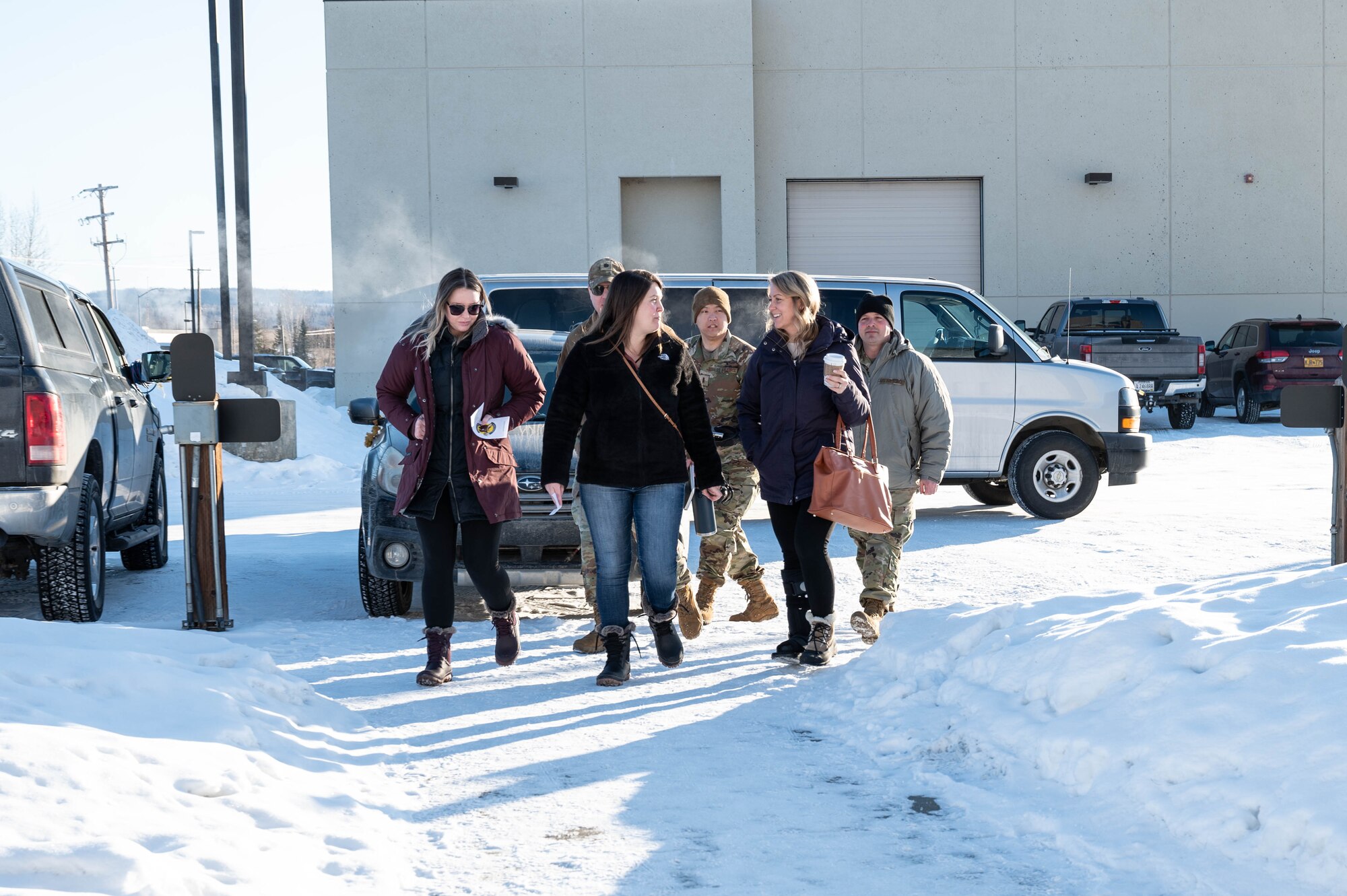 Spouses from the 354th Maintenance Squadron walk-in for the 354th MXS spouses' open house March 1, 2024, at Eielson Air Force Base, Alaska.