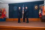 Col. William Gutermuth, 433rd Airlift Wing commander, presents the guidon to Col. James Bershinsky, 433rd Medical Group commander, during the 433rd MDG assumption of command ceremony at Joint Base San Antonio-Lackland, Texas, March 3, 2024.