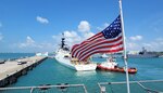 U.S. Coast Guard Cutter Bertholf (WMSL 750) is assisted by tugs as it arrives at Changi Naval Base in Singapore, Feb. 25, 2024. The Bertholf moored next to USS Gabrielle Giffords (LCS 10), a U.S. Navy Littoral Combat Ship, also in the region to support an open Indo-Pacific region. (U.S. Navy photo by Commander Samuel Hoard, Jr.)