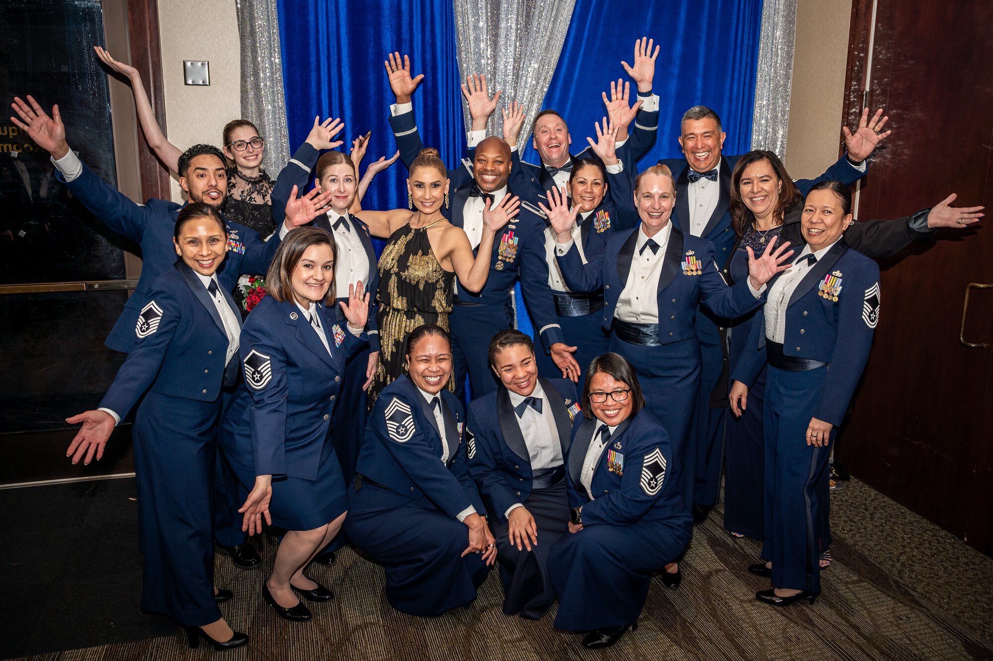 A group photo of 349 AMW leadership, personnel, and newly sewn on chief master sergeants celebrating.