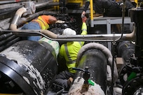 Personnel in support of Joint Task Force-Red Hill (JTF-RH) set up spill containment before defueling residual fuel at the Underground Pump House located on Joint Base Pearl Harbor-Hickam (JBPHH), Hawaii, March 4, 2024, where personnel are preparing to disconnect the Red Hill Bulk Fuel Storage Facility (RHBFSF) from the Underground Pump House.