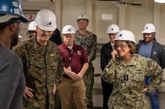 PASCAGOULA, Miss. (Mar. 4, 2024) – Chief of Naval Operations Adm. Lisa Franchetti addresses shipyard workers and crew members of the San Antonio-class amphibious transport dock PCU Richard M. McCool Jr. (LPD 29) over the 1MC during a tour of the ship while visiting Ingalls Shipbuilding in Pascagoula, Miss., Mar. 4. Franchetti and the Assistant Commandant of the Marine Corps Gen. Christopher Mahoney were able to interact with U.S. Navy Sailors and civilians, industry leadership, and members of Congress during the Gulf Coast visit. (U.S. Navy photo by Chief Mass Communication Specialist Michael B. Zingaro)