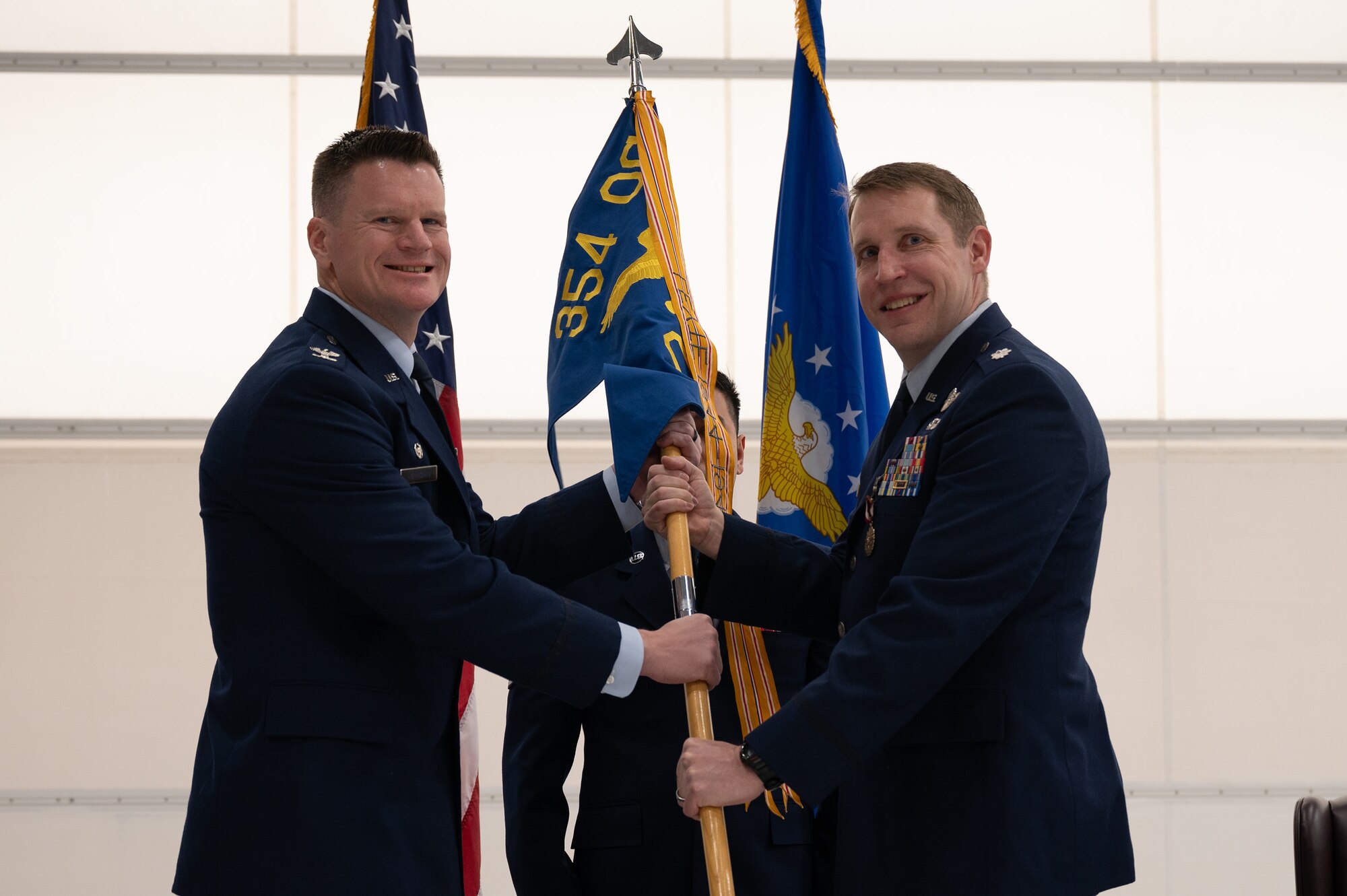 Photo of Lt. Col. Abraham Lehmann returning the guidon during the change of command of 354th OSS at Eielson Air Force Base, Alaska.