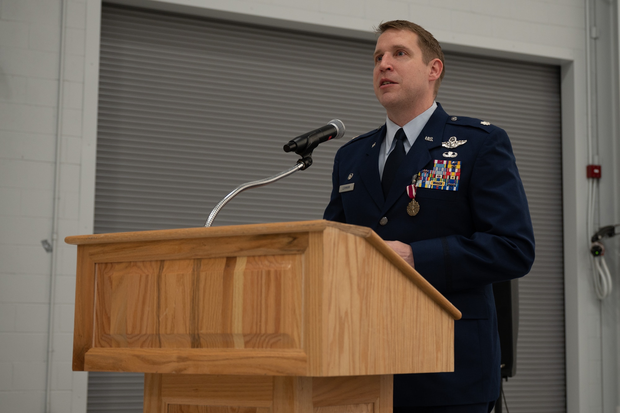 U.S. Air Force Lt. Col. Abraham Lehmann, outgoing 354th Operations Support Squadron commander, addresses the family, friends and Airmen attending the OSS change of command ceremony at Eielson Air Force Base, Alaska, March 1, 2024.