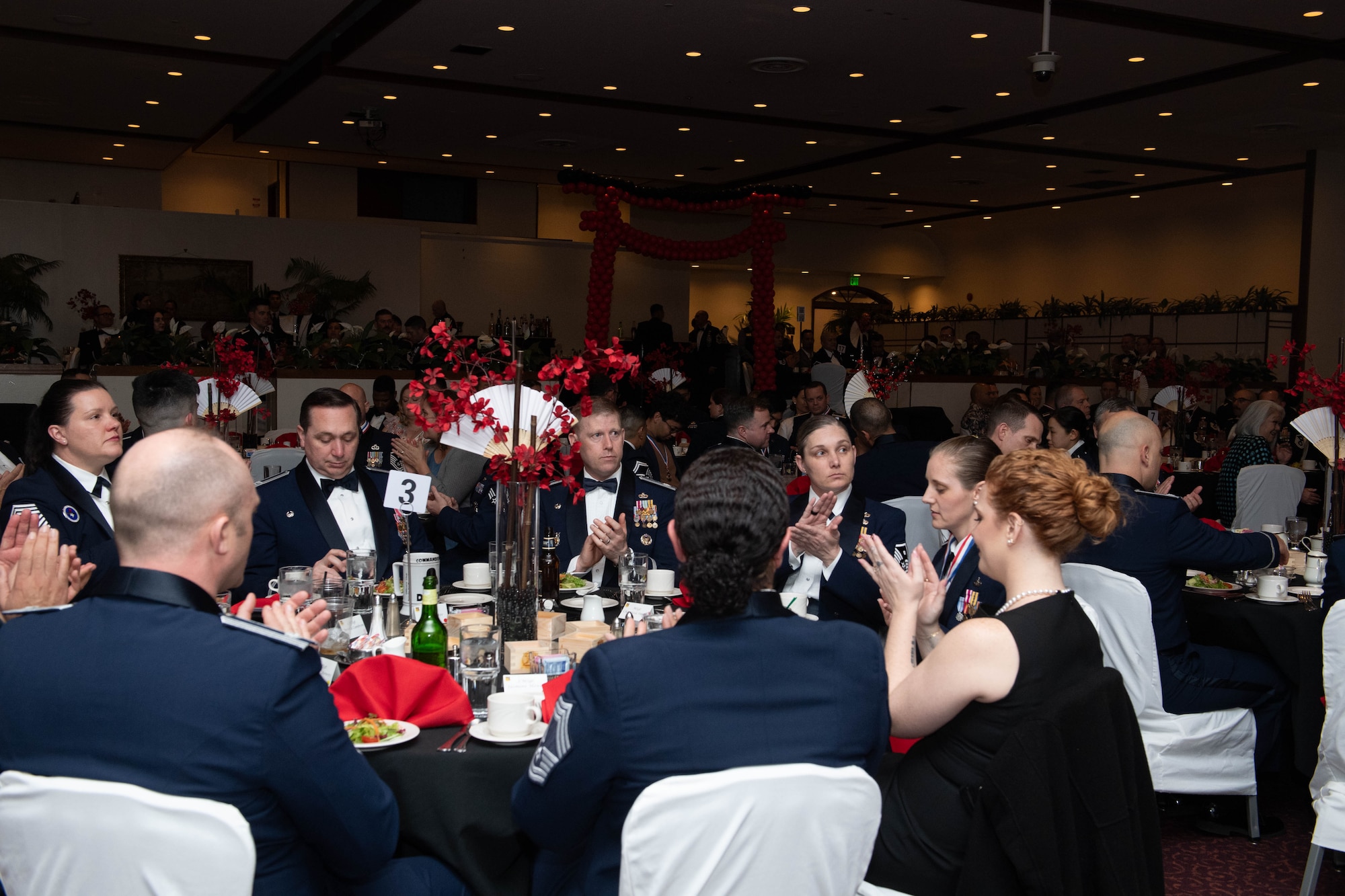 People raise their glasses for a toast.