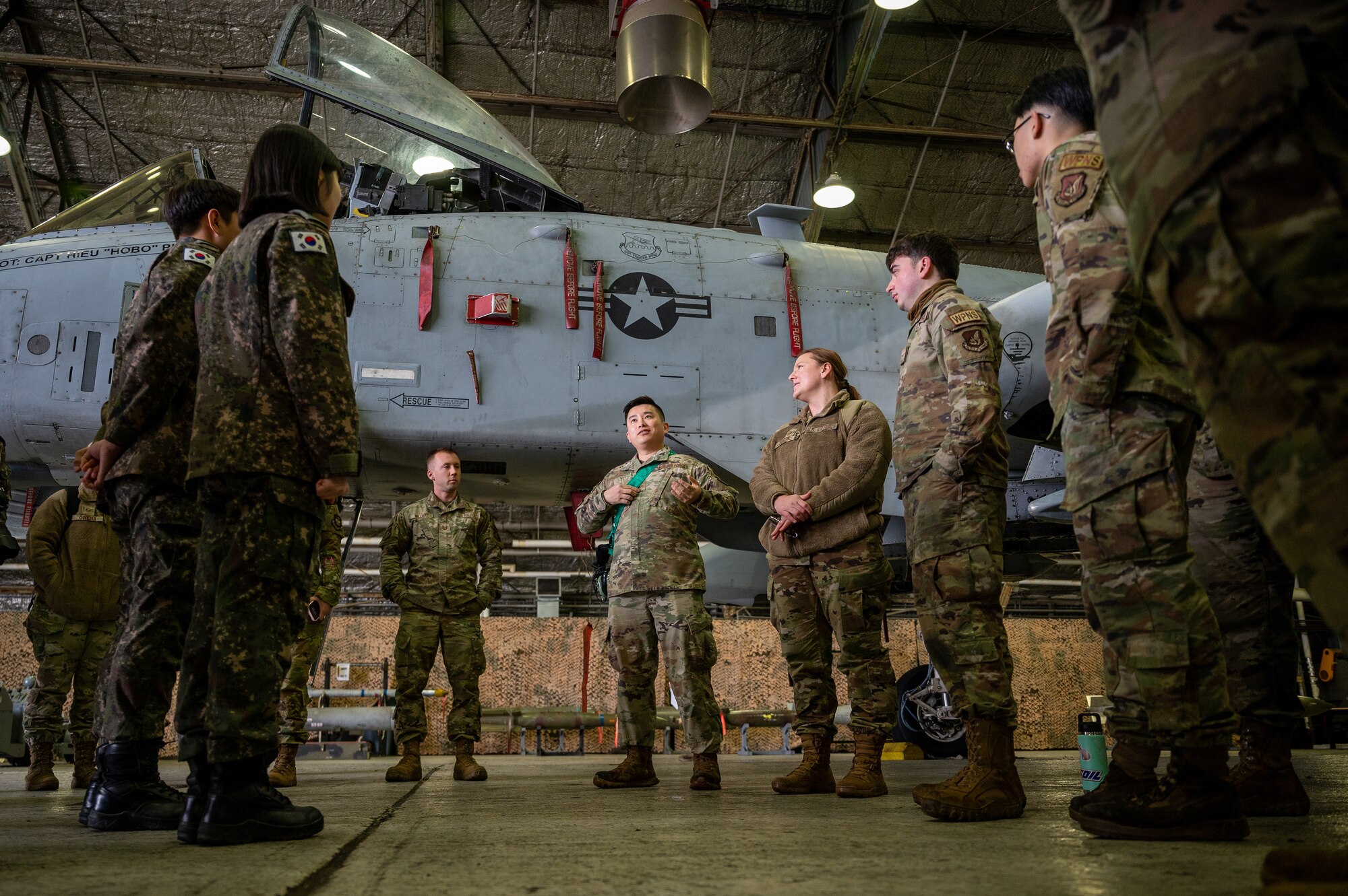 U.S. Air Force Airmen assigned to the 25th Fighter Generation Squadron brief Republic of Korea Air Force airmen on the capabilities and mission set of the A-10C Thunderbolt II during a Noncommissioned Officer Summit at Osan Air Base, Republic of Korea, Feb. 22, 2024. The summit provided a rare opportunity for Airmen who do not typically work closely with ROKAF counterparts to gain a clearer understanding of their collaborative mission to deter aggression and defend the ROK. (U.S. Air Force photo by Staff Sgt. Thomas Sjoberg)