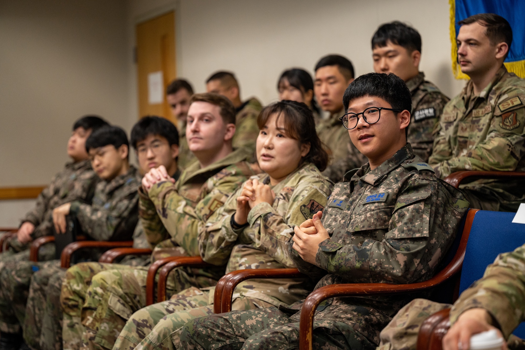 Republic of Korea Air Force airmen and U.S. Air Force Airmen assigned to the 51st Fighter Wing listen to a presentation during a Noncommissioned Officer Summit at Osan Air Base, Republic of Korea, Feb. 22, 2024. The summit aimed to deepen the partnership and camaraderie among U.S. and ROKAF airmen in the E-5 and E-6 ranks, emphasizing teamwork at both the tactical and operational levels. (U.S. Air Force photo by Staff Sgt. Thomas Sjoberg)