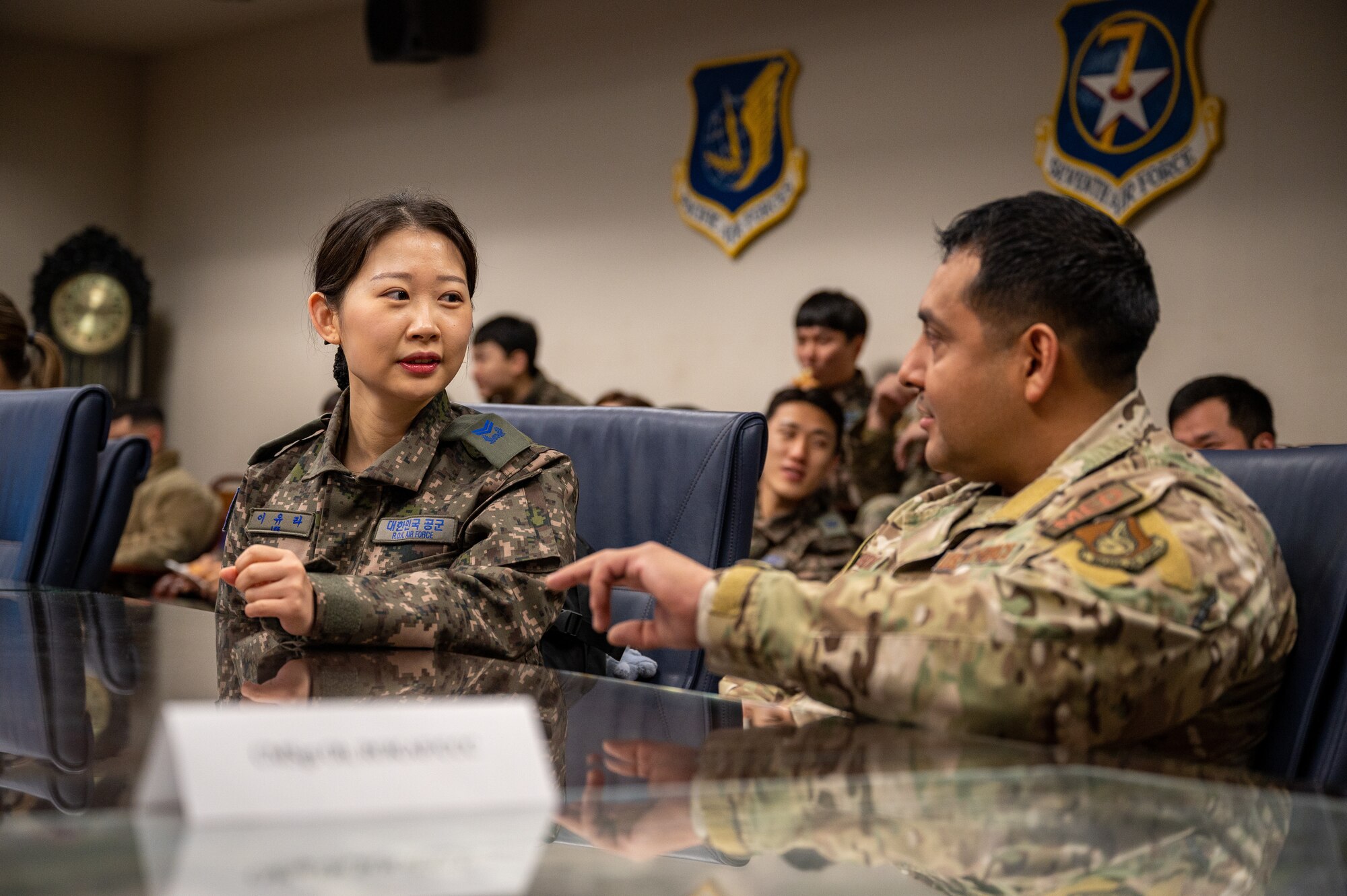 Republic of Korea Air Force Master Sgt. Lee, Yu Ra, ROKAF medic, left, and U.S. Air Force Tech. Sgt. Samuel Hernandez, 51st Medical Support Squadron medical material section chief, speak during a Noncommissioned Officer Summit at Osan Air Base, Republic of Korea, Feb. 22, 2024. The summit was held to foster collaboration and build on the solid foundation of partnership and alliance between the U.S. and ROK. (U.S. Air Force photo by Staff Sgt. Thomas Sjoberg)