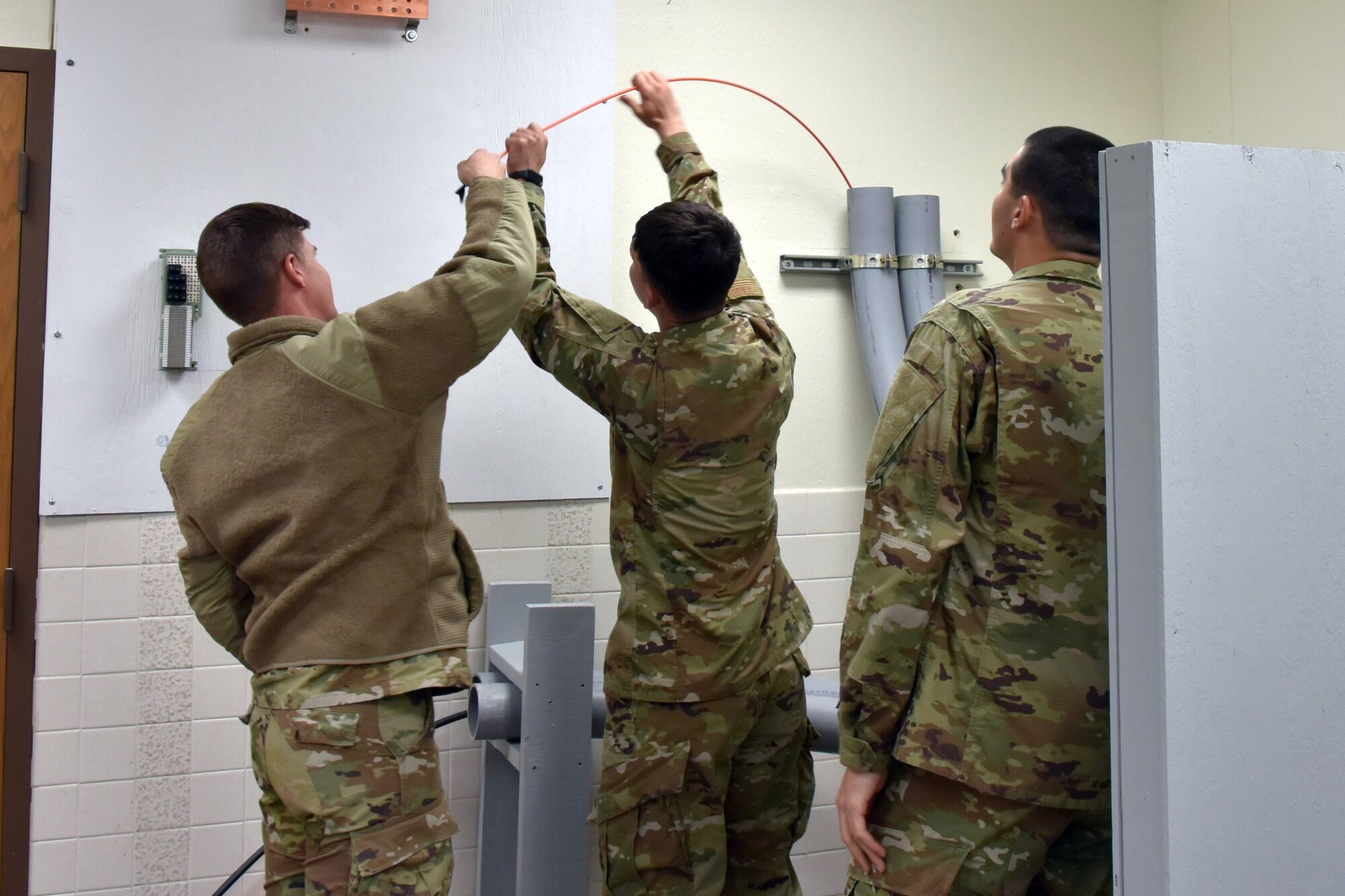 Airmen practice using telecom equipment