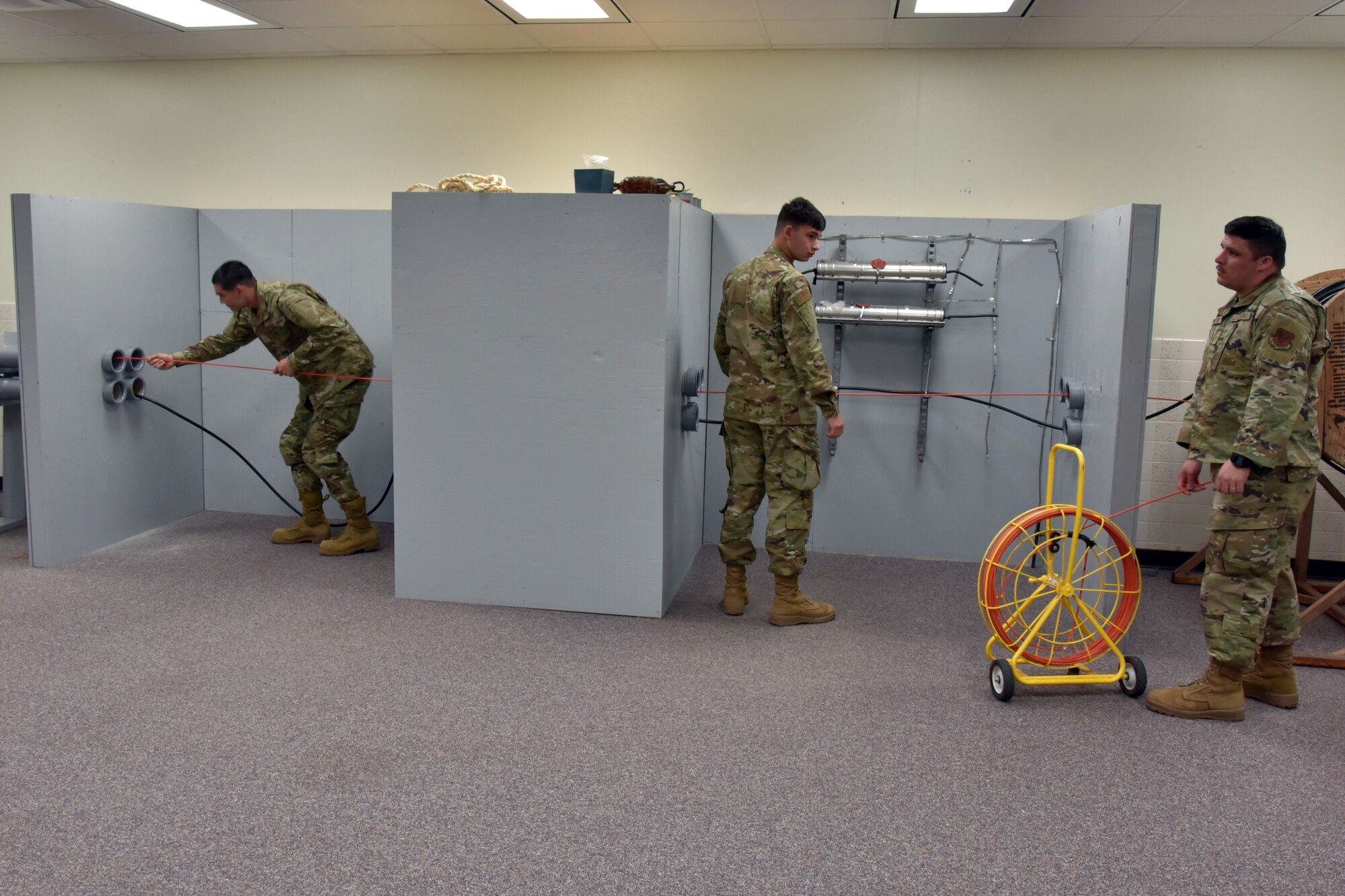 Airmen practice using telecom equipment