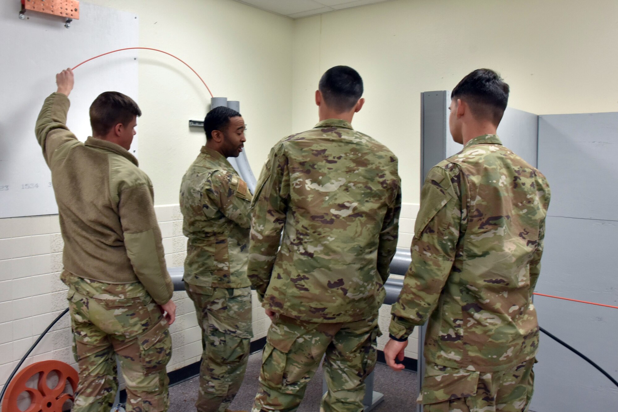 Airmen practice using telecom equipment