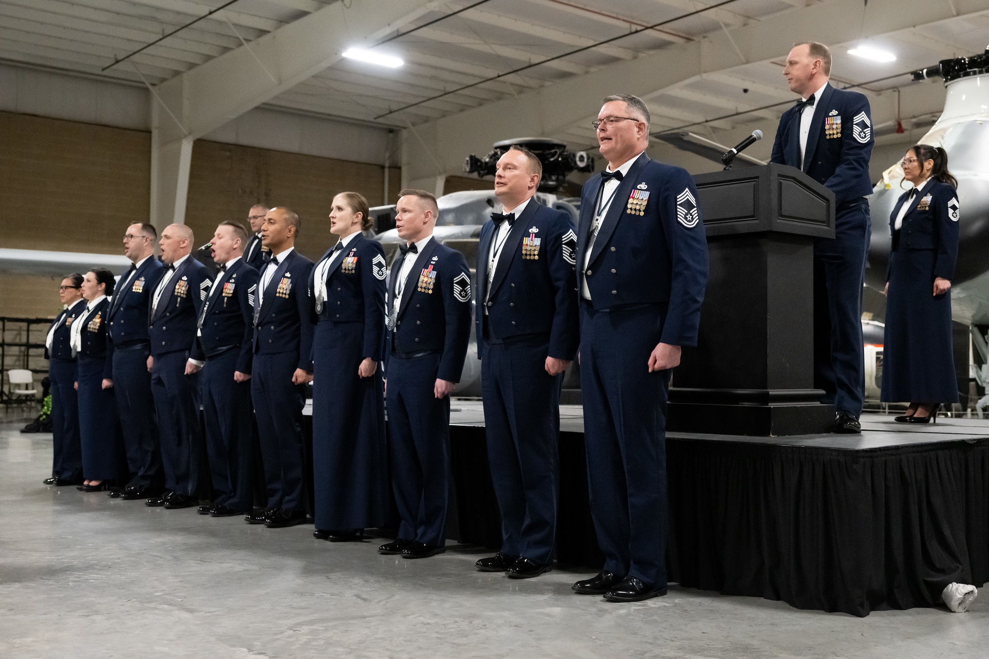 Hill's newest chief master sergeants accept the charge of their new rank during the base's Chief Master Sergeant Recognition Ceremony at Hill Air Force Base, Utah, March 2, 2024. The ceremony celebrated the hard work, dedication, loyalty and sacrifice of 11 Airmen achieving the highest enlisted rank in the Air Force. (U.S. Air Force photo by R. Nial Bradshaw)