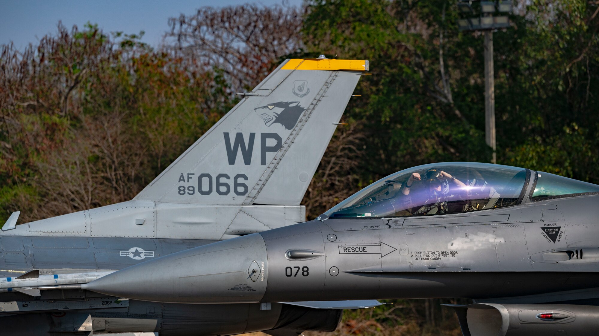 F-16 Fighting Falcon pilot, performs a gesture of squadron pride upon arrival from participation in a maritime strike exercise scenario