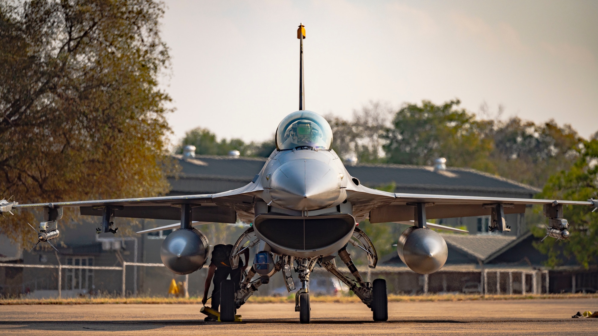 F-16 Fighting Falcon pilot, parks an F-16 upon return from participating in a maritime strike exercise scenario