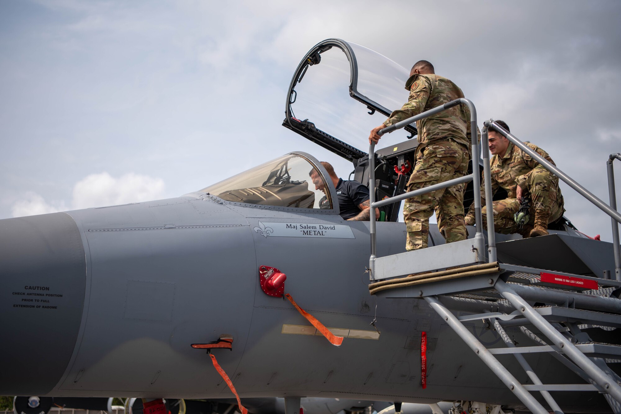 Dakota Meyer sits inside of an F-15C Eagle