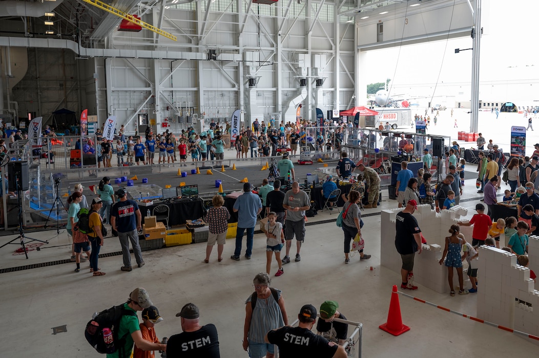 First Robotics hosts a robot design competition in an aircraft hangar.