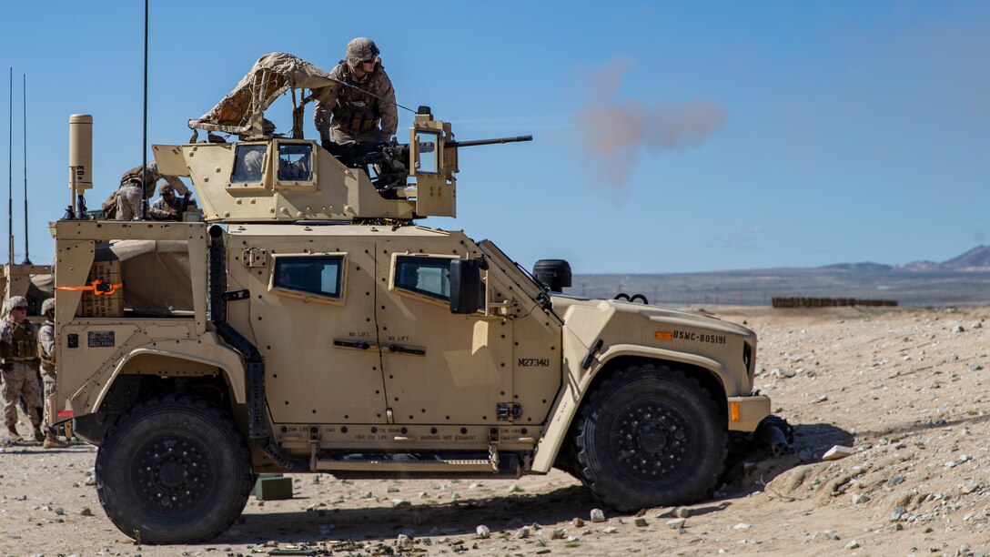 U.S. Marines with Combat Logistics Battalion 2, Combat Logistics Regiment 2, 2nd Marine Logistics Group, fire a M2A1 Browning Machine Gun from a Joint Light Tactical Vehicle during a live fire range as part of Adversary Force Exercise at Marine Corps Air Ground Combat Center Twentynine Palms, California, Feb. 27, 2024. The purpose of AFX is to create a credible, realistic threat for the exercise forces participating in Service Level Training Exercise 2-24. (U.S. Marine Corps photo by Cpl. Alfonso Livrieri)