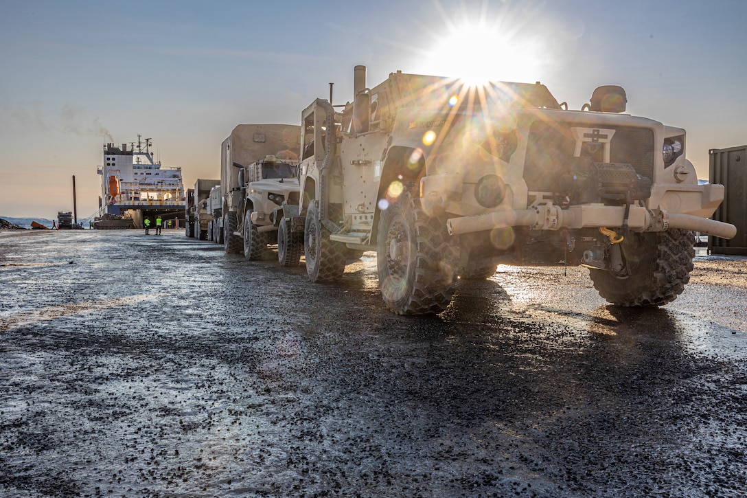 U.S. Marine Corps Joint Light Tactical Vehicles with Combat Logistics Battalion 6, Combat Logistics Regiment 2, 2nd Marine Logistics Group, staged at a pier offload in preparation for Exercise Nordic Response 24 in Talvik, Norway, March 2, 2024.  Exercise Nordic Response 24 is a biennial NATO exercise designed to enhance military capabilities and allied cooperation.  This exercise will test military activities ranging from the reception of allied and partner reinforcements and command and control interoperability to combined joint operations, maritime prepositioning force logistics, integration under challenging Arctic conditions, in high-intensity warfighting including rugged terrain and extreme cold weather with NATO militaries, and reacting against an adversary force during a dynamic training environment.  (U.S. Marine Corps photo by Lance Cpl. Christian Salazar)