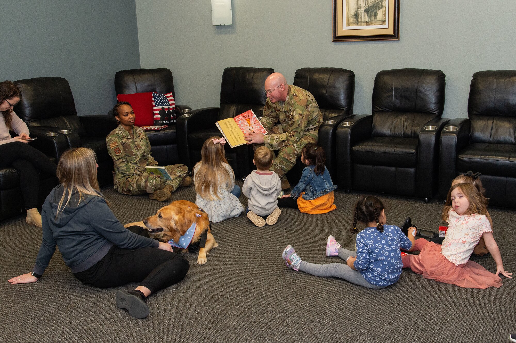 436th AW commander, command chief lead story time at the USO