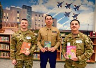 Soldiers with books in library.