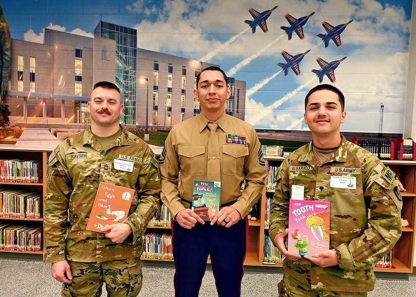 Soldiers with books in library.
