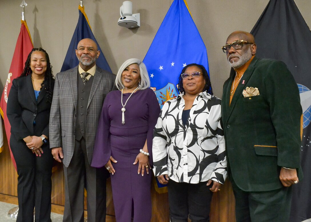DLA Troop Support Deputy Commander Kishayra Lambert, left, stands next to four Troop Support employees, who retired after a combined 127 years of federal service, during a ceremony held Feb. 29, in Philadelphia.