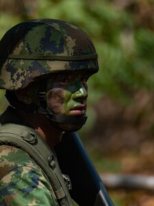 A Royal Thai Marine posts security during an amphibious assault demonstration for Cobra Gold 24 at Hat Yao Beach in Rayong province, Kingdom of Thailand, March 1, 2024. Exercise Cobra Gold is the largest joint exercise in mainland Asia and a concrete example of the strong alliance and strategic relationship between Thailand and the United States.