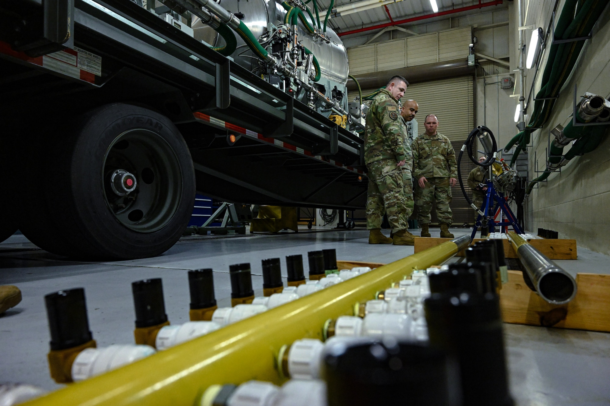 Chief Master Sgt. Israel Nuñez, senior enlisted advisor to the Chief of Air Force Reserve and Command Chief Master Sergeant of Air Force Reserve Command, engages with 910th Airlift Wing aerial spray maintainers during a base tour at Youngstown Air Reserve Station, Ohio, March 2, 2024.