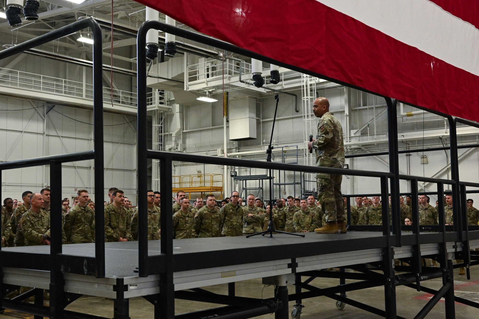 Chief Master Sgt. Israel Nuñez, senior enlisted advisor to the Chief of Air Force Reserve and Command Chief Master Sergeant of Air Force Reserve Command, speaks with 910th Airlift Wing Airmen during an enlisted all call at Youngstown Air Reserve Station, Ohio, March 3, 2024.