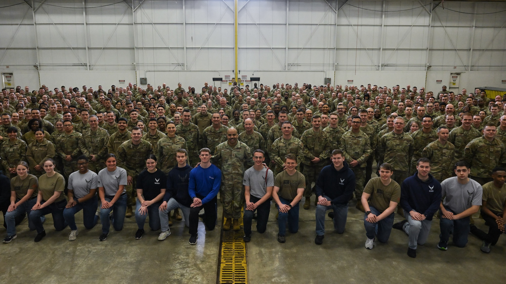Chief Master Sgt. Israel Nuñez, senior enlisted advisor to the Chief of Air Force Reserve and Command Chief Master Sergeant of Air Force Reserve Command, poses for a photo with 910th Airlift Wing Airmen during an enlisted all call at Youngstown Air Reserve Station, Ohio, March 3, 2024.