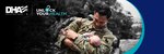 Image of Service Member holding baby in his arms.