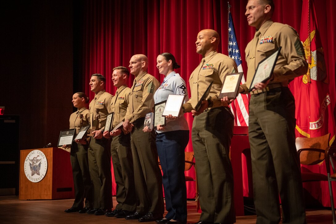 The Senior Enlisted Advisor to the Chairman (SEAC), SgtMaj Black, was the guest speaker at the Quantico SNCO Academy graduation for the Career and Advanced Schools on 28 Feb 2024.  The SEAC highlighted the importance of interoperability within the service branches.  He is pictured with the distinguished graduates, which includes Air Force MSgt Amanda Armenti who was the Advanced School Academic Excellence recipient.