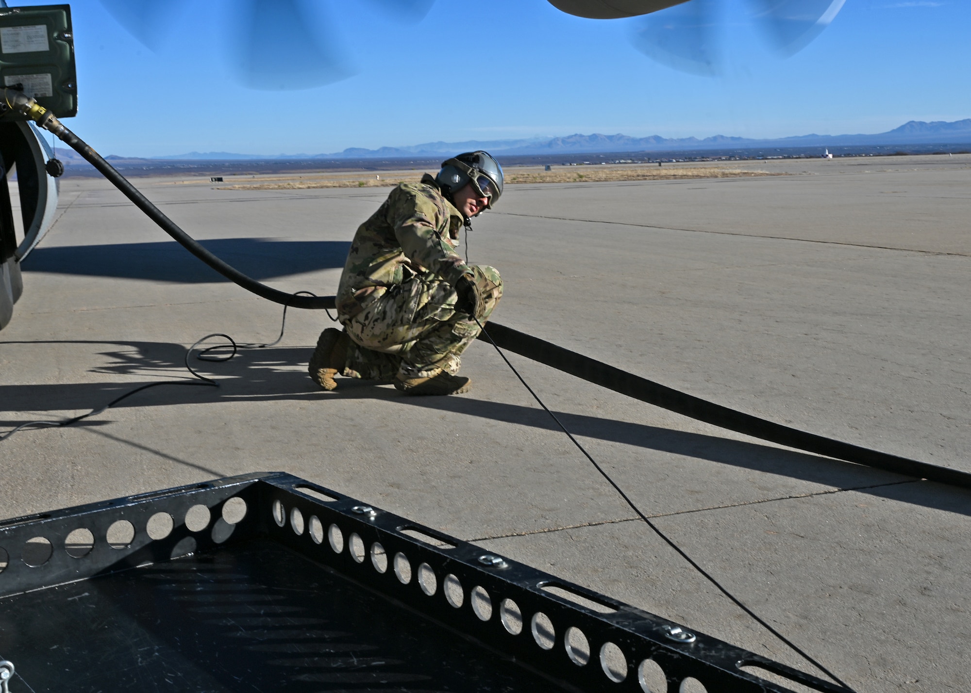 A U.S. Airman assigned to the 355th Logistics Readiness Squadron prepare for a forward area refueling point during Exercise Agile Angel at Fort Huachuca, Ariz., Feb. 20, 2024. The purpose of FARP operators was to expeditiously transfer fuel from a tanker aircraft into a receiver aircraft, while aircraft engines remain on. (U.S. Air Force photo by Staff Sgt. Abbey Rieves)