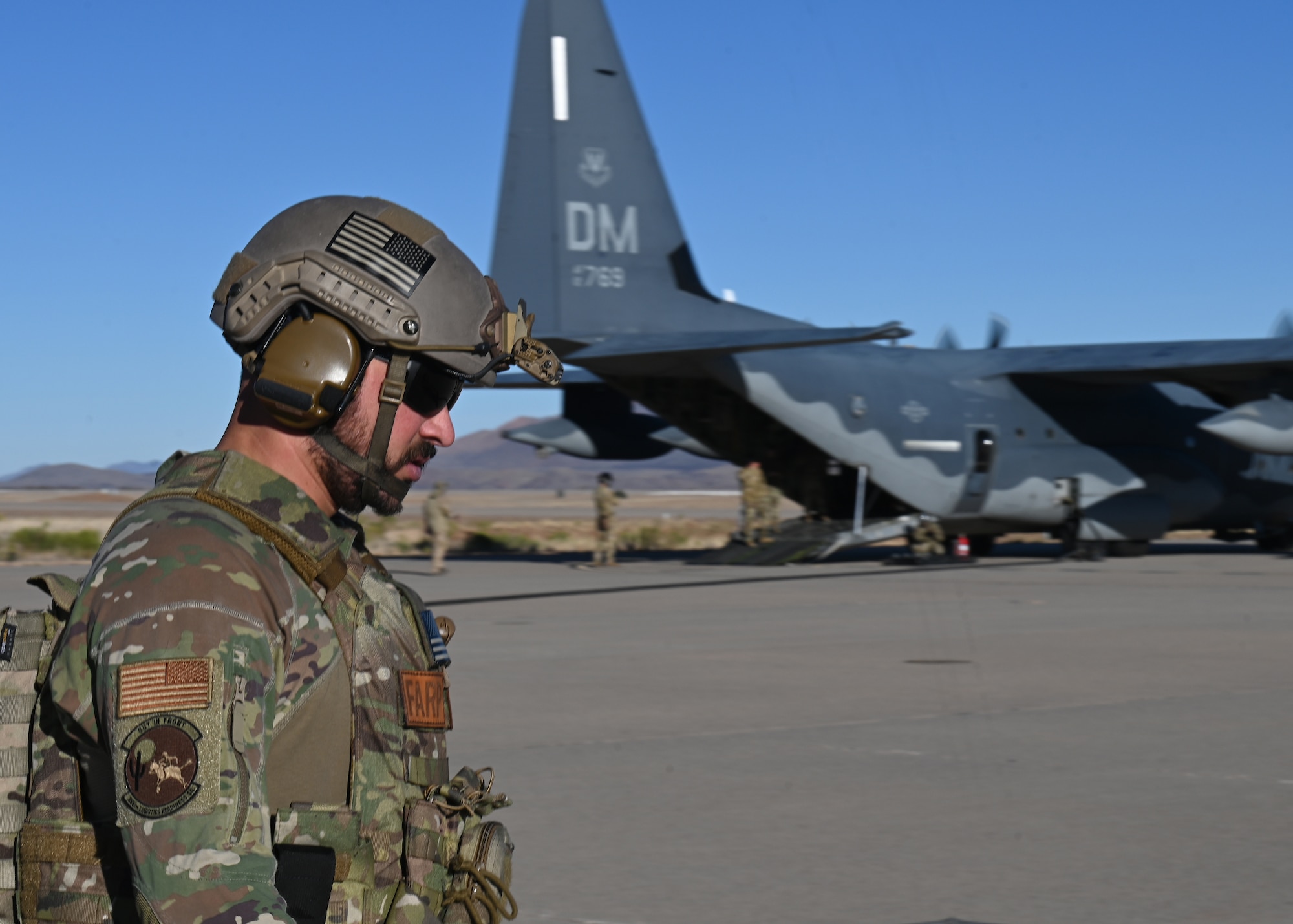 U.S. Air Force Tech. Sgt. Daniel Middaugh, 355th Logistics Readiness Squadron forward area refueling point operator, preps for FARP during Exercise Agile Angel at Fort Huachuca, Ariz., Feb. 20, 2024. Middaugh verified the simulated location was ready for the arriving aircraft. (U.S. Air Force photo by Staff Sgt. Abbey Rieves)