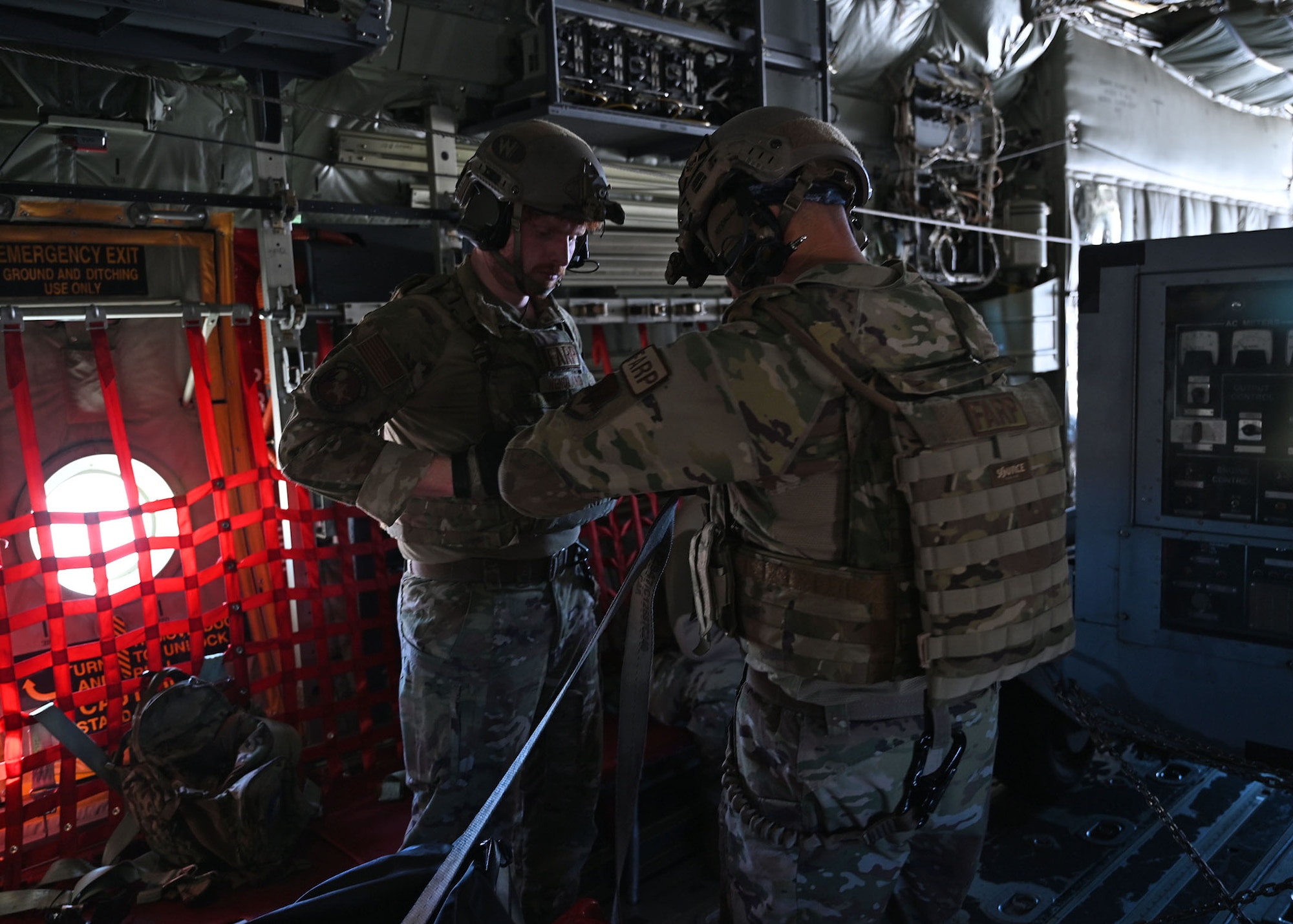 U.S. Air Force Tech. Sgt. Daniel Middaugh, right, and Senior Airman Oliver Wendland, left, 355th Logistics Readiness Squadron forward area refueling point operators, load an HC-130J Combat King II aircraft during Exercise Agile Angel at Fort Huachuca, Ariz., Feb. 20, 2024. FARP was a formalized program created to refuel aircrafts usually during nighttime operations in austere conditions. (U.S. Air Force photo by Staff Sgt. Abbey Rieves)