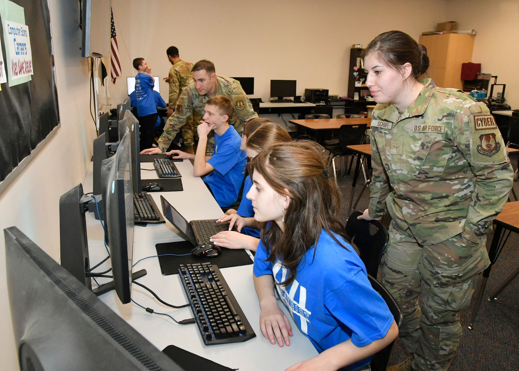 (Left to right) Beonka Dirito, student and “Cyber Patriot” team member, reviews an image with Airman 1st Class Kaeli Schiff, client systems technician, 75th Communication and Information Directorate Feb. 14, 2024, at Quest Academy Charter School in West Haven, Utah. The student team recently competed in the National Youth Cyber Defense Competition, the nation's largest that puts middle and high school students in charge of securing a simulated virtual network. The middle school team placed first in the state of Utah this year, which was in the top 11% nationally of the state finals competition and in the top 15% nationally in the national semi-finals.