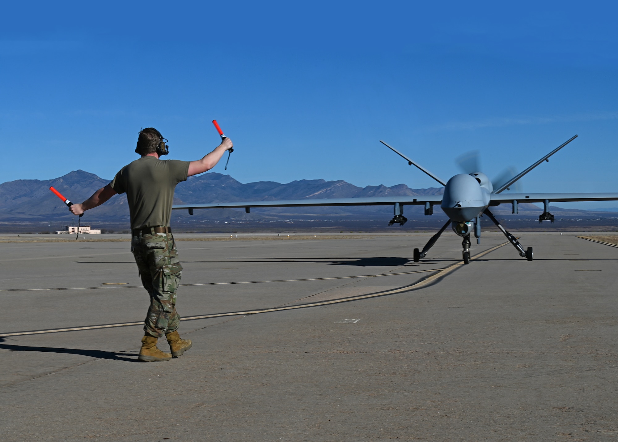 A U.S. service member assigned to Fort Huachuca, Ariz., taxis in an MQ-9 Reaper unmanned aerial vehicle during Exercise Agile Angel at Fort Huachuca, Ariz., Feb. 20, 2024. The exercise incorporated joint military aspects, while focusing on U.S. Air Force Special Warfare members operating outside of their primary roles, ultimately creating a faster return to operations. (U.S. Air Force photo by Staff Sgt. Abbey Rieves)