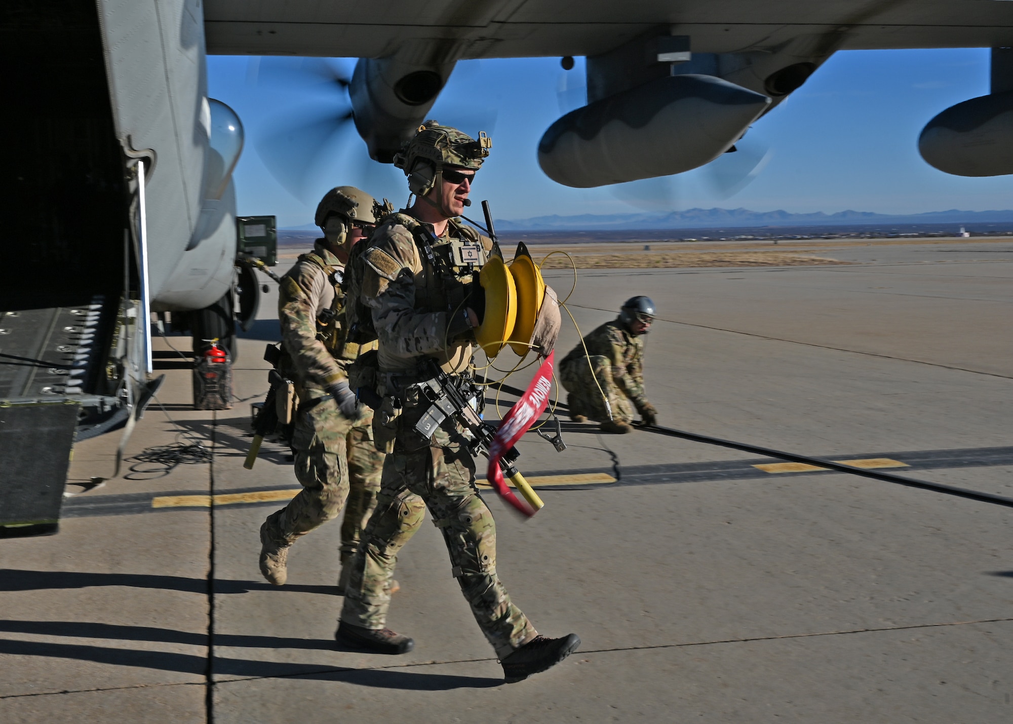 A U.S. Airman assigned to the 48th Rescue Squadron prepares for the arrival of an MQ-9 Reaper unmanned aerial vehicle during Exercise Agile Angel at Fort Huachuca, Ariz., Feb. 20, 2024. The 48th RQS was trained to execute an integrated combat turn demonstrating the ability to establish and operate in-extremis and austere contingency locations. (U.S. Air Force photo by Staff Sgt. Abbey Rieves)