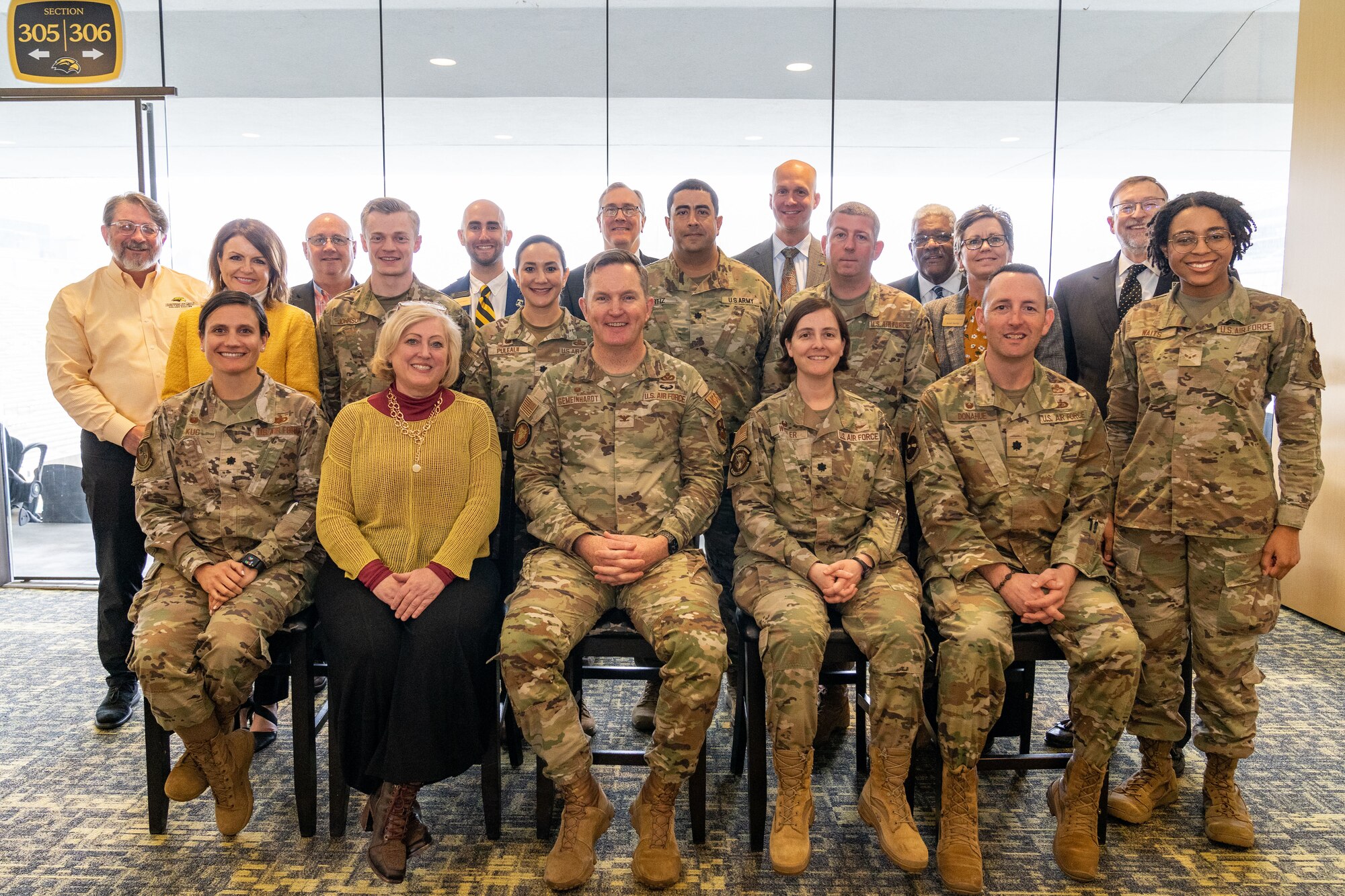 Members from the 81st Training Wing and staff from the University of Southern Mississippi pose for a photo in Hattiesburg, Mississippi, March 1, 2024.