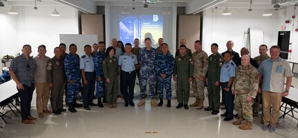 Members of the U.S. Air Force, Indonesian Air Force, Philippine Air Force, Royal Australian Air Force, Royal Malaysian Air Force and Department of Defense employees pose for a group photo at the Regional Air Domain Awareness Senior Leader Seminar on Andersen Air Force Base, Guam, Feb. 26, 2024. Throughout the seminar, leaders discussed air domain strategies, policies, terminology and also developed a network of Allies and partners that have a shared understanding of air domain awareness. (U.S. Air Force photo by Airman 1st Class Spencer Perkins)