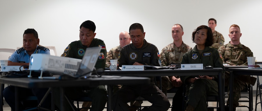 Members of the U.S. Air Force, Philippine Air Force and Royal Malaysian Air Force listen to briefings during the Regional Air Domain Awareness Senior Leader Seminar on Andersen Air Force Base, Guam, Feb. 26, 2024. Throughout the seminar, leaders discussed air domain strategies, policies, terminology and also developed a network of Allies and partners that have a shared understanding of air domain awareness. (U.S. Air Force photo by Airman 1st Class Spencer Perkins)