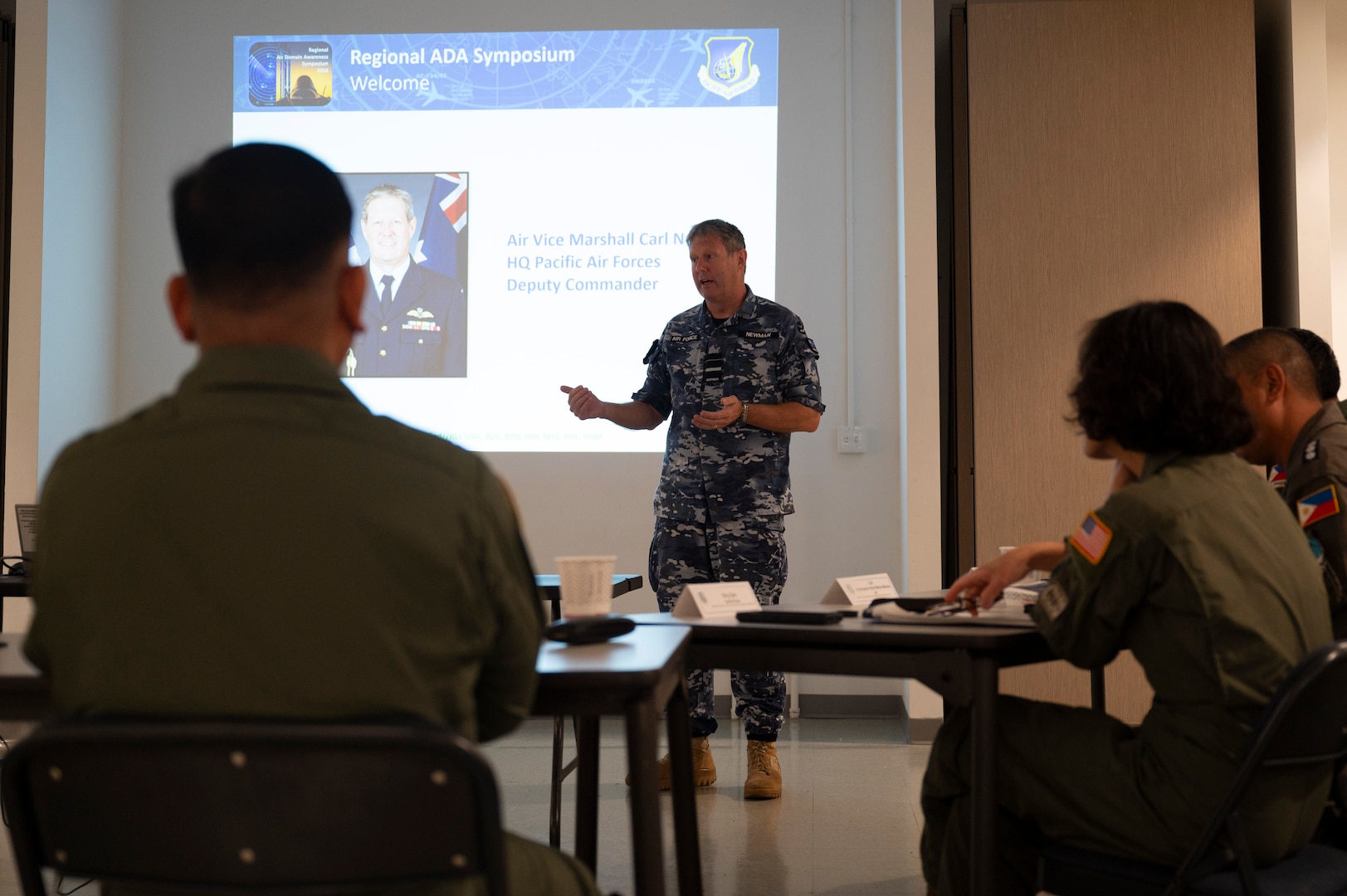Royal Australian Air Force Air-Vice-Marshal, Pacific Air Forces deputy commander, speaks to participants of the Regional Air Domain Senior Leader Seminar on Andersen Air Force Base, Guam, Feb. 26, 2024. Throughout the seminar, leaders discussed air domain strategies, policies, terminology and also developed a network of Allies and partners that have a shared understanding of air domain awareness. (U.S. Air Force photo by Airman 1st Class Spencer Perkins)