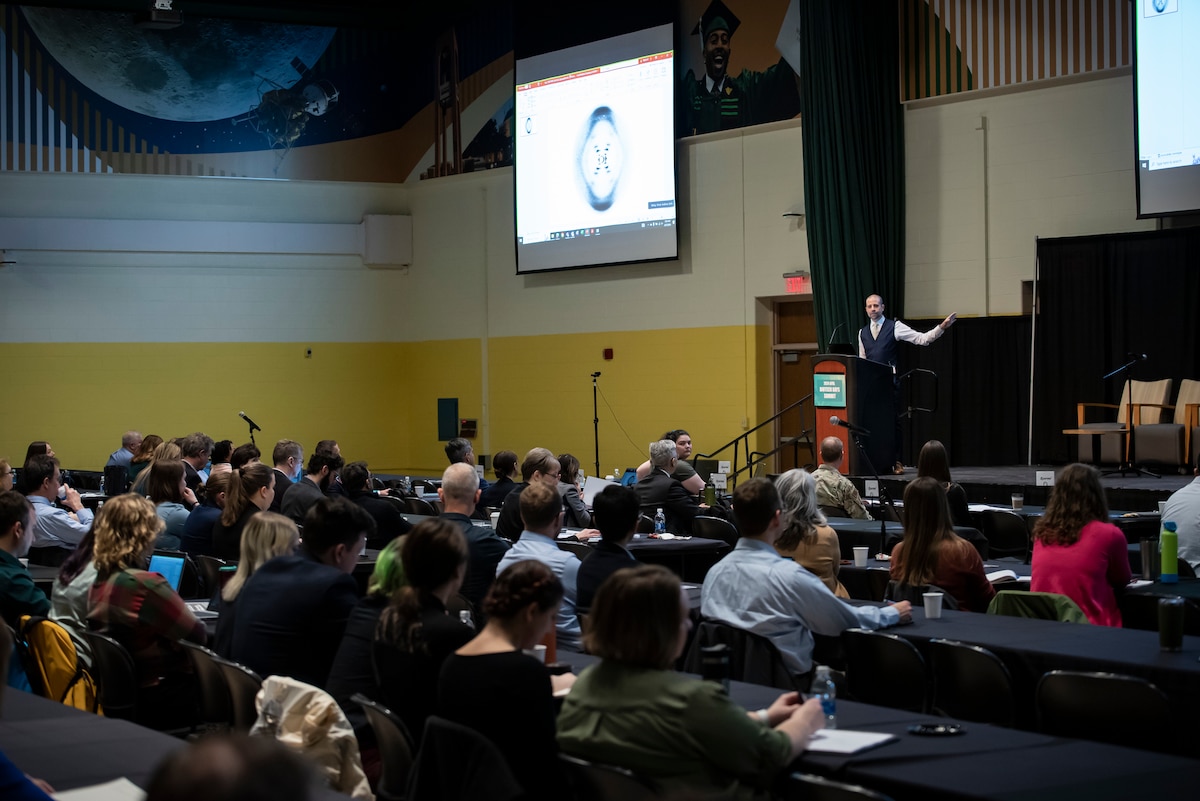 Dr. Seth A. Faith, senior scientist for biotechnology and biomedical sciences, Air Force Research Laboratory, or AFRL, 711th Human Performance Wing, delivers opening remarks at the AFRL Biotech Days Summit Feb. 27, 2024, at Wright-State University in Dayton, Ohio. AFRL scientists and engineers met with strategic partners from the Department of Defense, other U.S. government agencies, academia, industry and state organizations to share progress and collaborate during this two-day event attended by more than 275 people. (U.S. Air Force photo / Richard Eldridge).