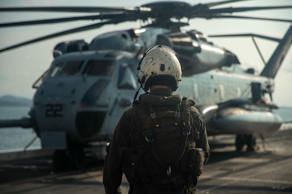 A U.S. Marine Corps CH-53E Super Stallion crew chief assigned to Marine Medium Tiltrotor Squadron (VMM) 165 (Reinforced), 15th Marine Expeditionary Unit, prepares for flight operations in support of Exercise Cobra Gold in the Gulf of Thailand Feb. 23, 2024. Cobra Gold demonstrates the U.S. commitment to the region by building interoperability, multilateral cooperative arrangements, advancing common interests, and a commitment to our allies and partners in ensuring a free and open Indo-Pacific region.