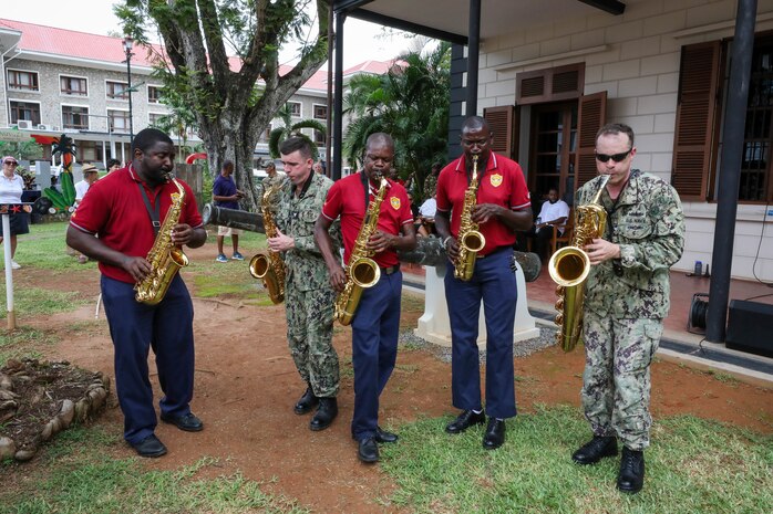 VICTORIA, Seychelles (Feb. 27, 2024) Members from the U.S. Naval Forces Europe and Africa Band and the Seychelles Defence Forces (SDF) Band perform for an audience at the Seychelles National Museum of History as part of exercise Cutlass Express 2024 (CE 24). Cutlass Express 2024, conducted by U.S. Naval Forces Africa and sponsored by U.S. Africa Command, increases the readiness of U.S. forces; enhances maritime domain awareness and collaboration among participating nations; and strengthens the capability of partner nations to combat piracy and counter illicit trafficking and illegal, unreported, and unregulated fishing.