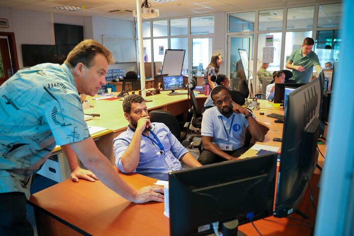 VICTORIA, Seychelles (Feb. 29, 2024) Vladimir Matveyev, left, an engineer and maritime domain awareness mentor for Naval Information Warfare Center (NIWC) Pacific, provides training on the web-based maritime situational awareness tool, SeaVision, to Terry Cesar and Ahmed Essack from the Seychelles Regional Coordination Operations Center during exercise Cutlass Express 2024 (CE 24). Cutlass Express 2024, conducted by U.S. Naval Forces Africa and sponsored by U.S. Africa Command, increases the readiness of U.S. forces; enhances maritime domain awareness and collaboration among participating nations; and strengthens the capability of partner nations to combat piracy and counter illicit trafficking and illegal, unreported, and unregulated fishing. (U.S. Navy Photo by Chief Mass Communications Specialist Arif Patani)