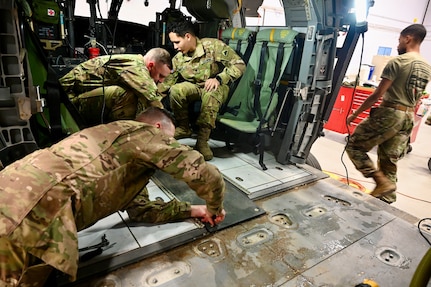 Avionic mechanics within District of Columbia Army National Guard Aviation remove ballistic armor from the interior of a UH-60 Blackhawk at Davison Army Airfield, Feb. 3, 2024.  DCARNG Aviation is comprised of four different units with women visibly represented in all sections to include pilots, maintainers, supply, operations, administration, and flight paramedics.