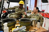 U.S. Army 1st Sgt. Angeli Viyar, Company First Sergeant standardizations instructor/senior flight medic, Delta Company 1-224th Aviation Regiment, discusses daily tasks with a member of the District of Columbia Army National Guard Aviationat Davison Army Airfield, Feb. 3, 2024.  DCARNG Aviation is comprised of four different units with women visibly represented in all sections to include pilots, maintainers, supply, operations, administration, and flight paramedics.